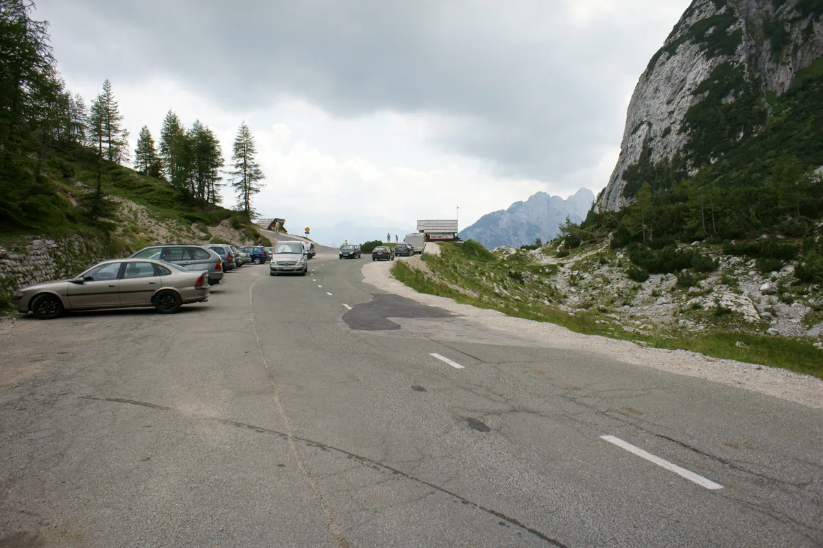 Mountain road and rocky slopes at Vršič Pass