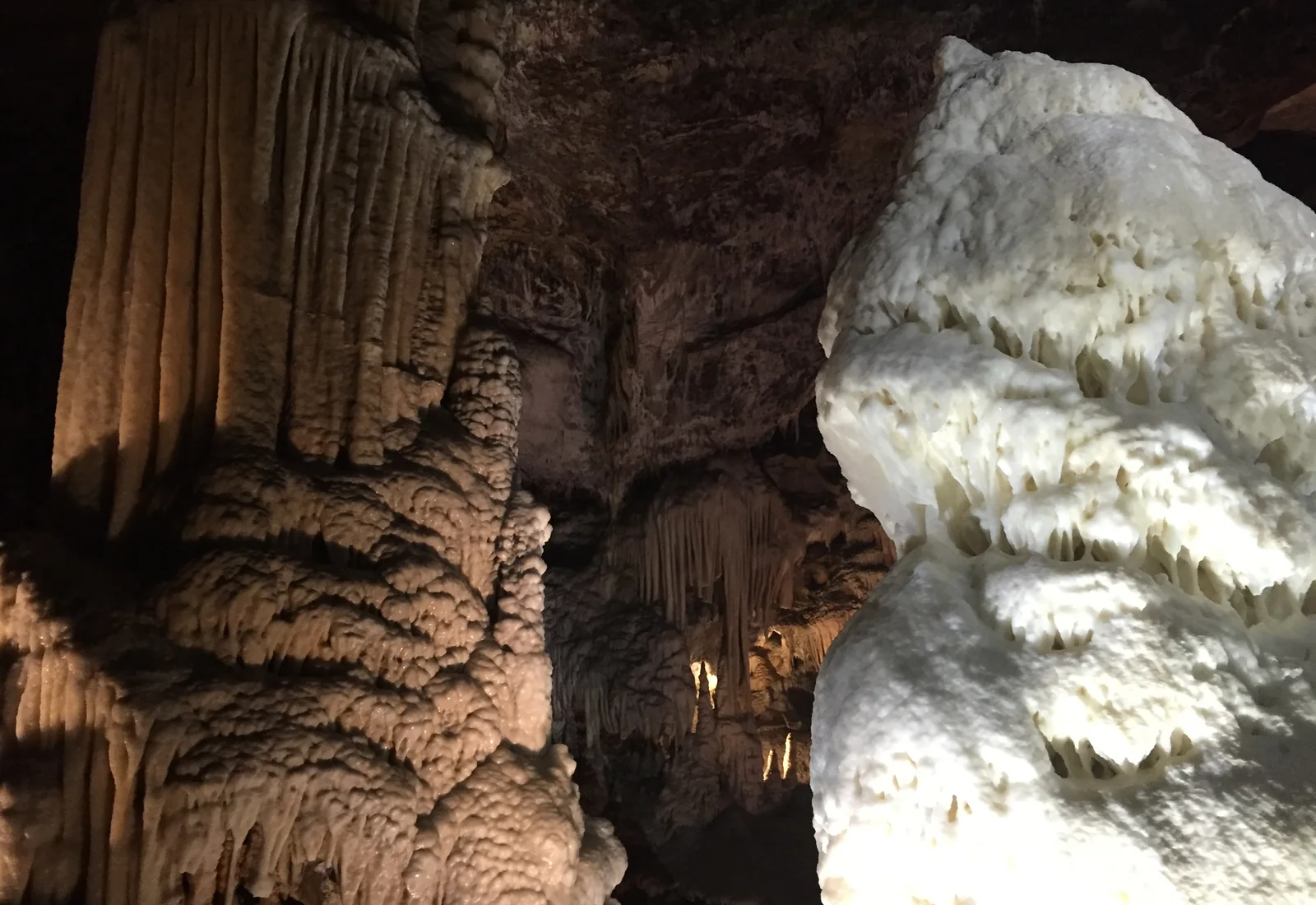 Brilliant white stalagmite inside Postojna Cave