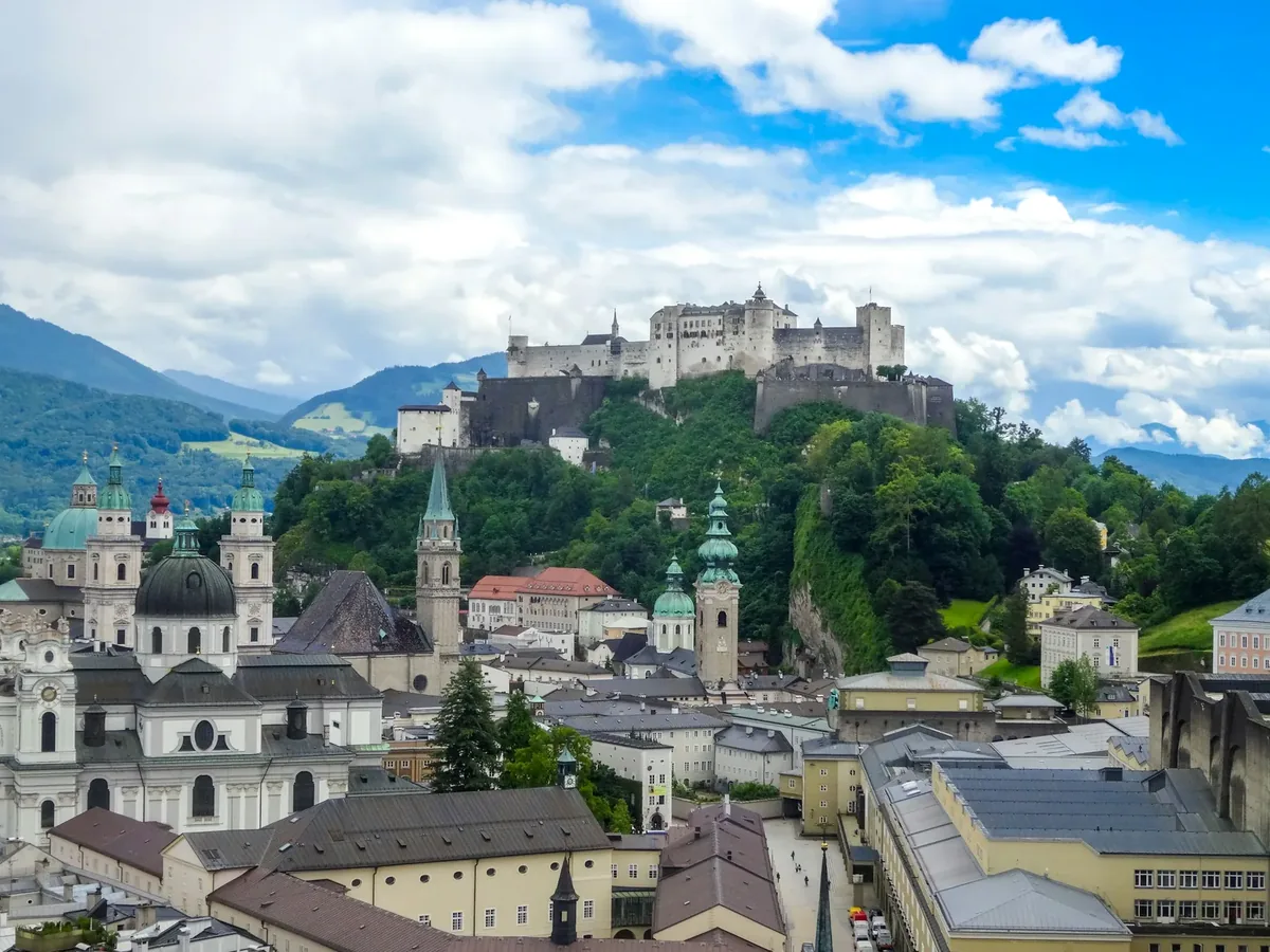 Hohensalzburg Fortress above Salzburg with the Alps in the background